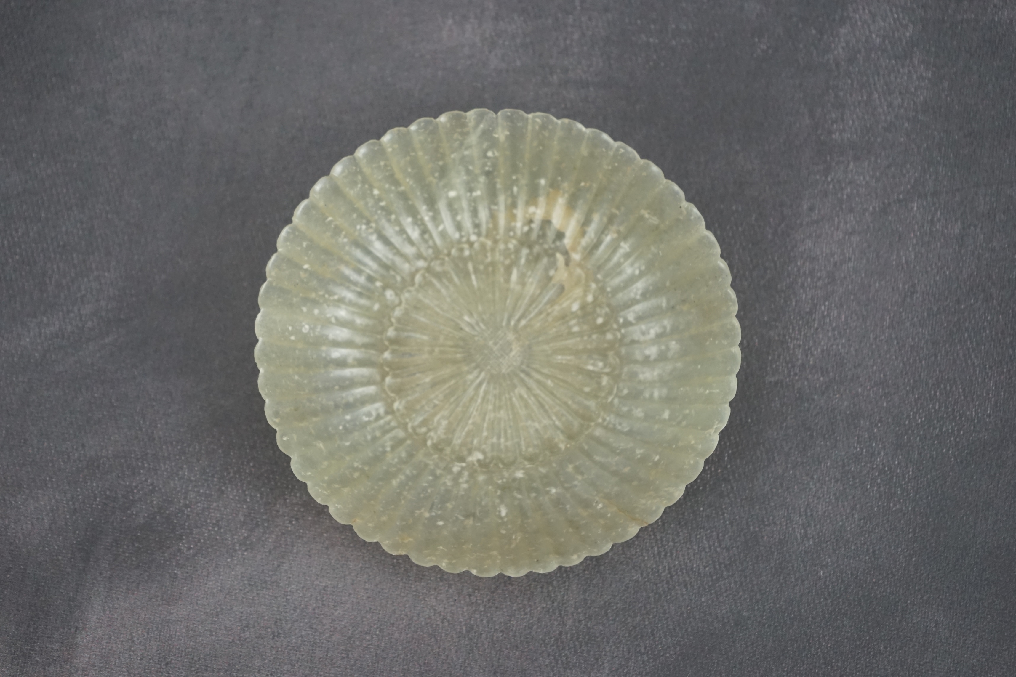 A Chinese pale celadon jade ‘chrysanthemum’ dish, Mughal style, 18th century